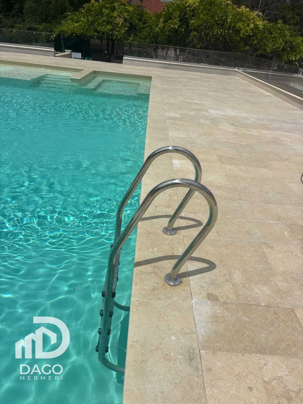 Pool with yellow marble coping